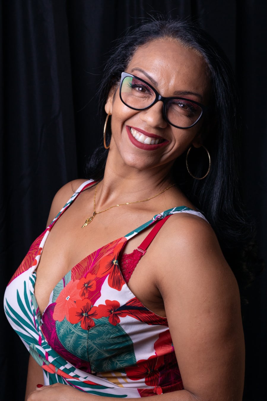 woman with glasses smiling